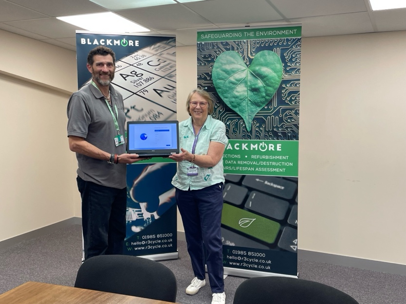 Simon Barfoot of BlackmoreIT & DonateIT presenting Linda Bunting of MEG with a laptop for Wimborne Food Bank.